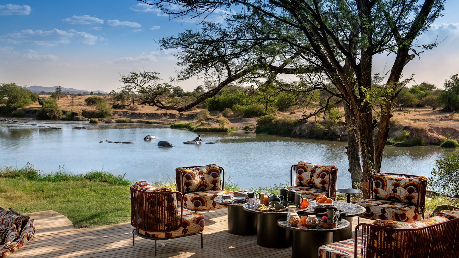 Afternoon Tea lounge experience overlooking the river at Grumeti Serengeti River Lodge in Tanzania